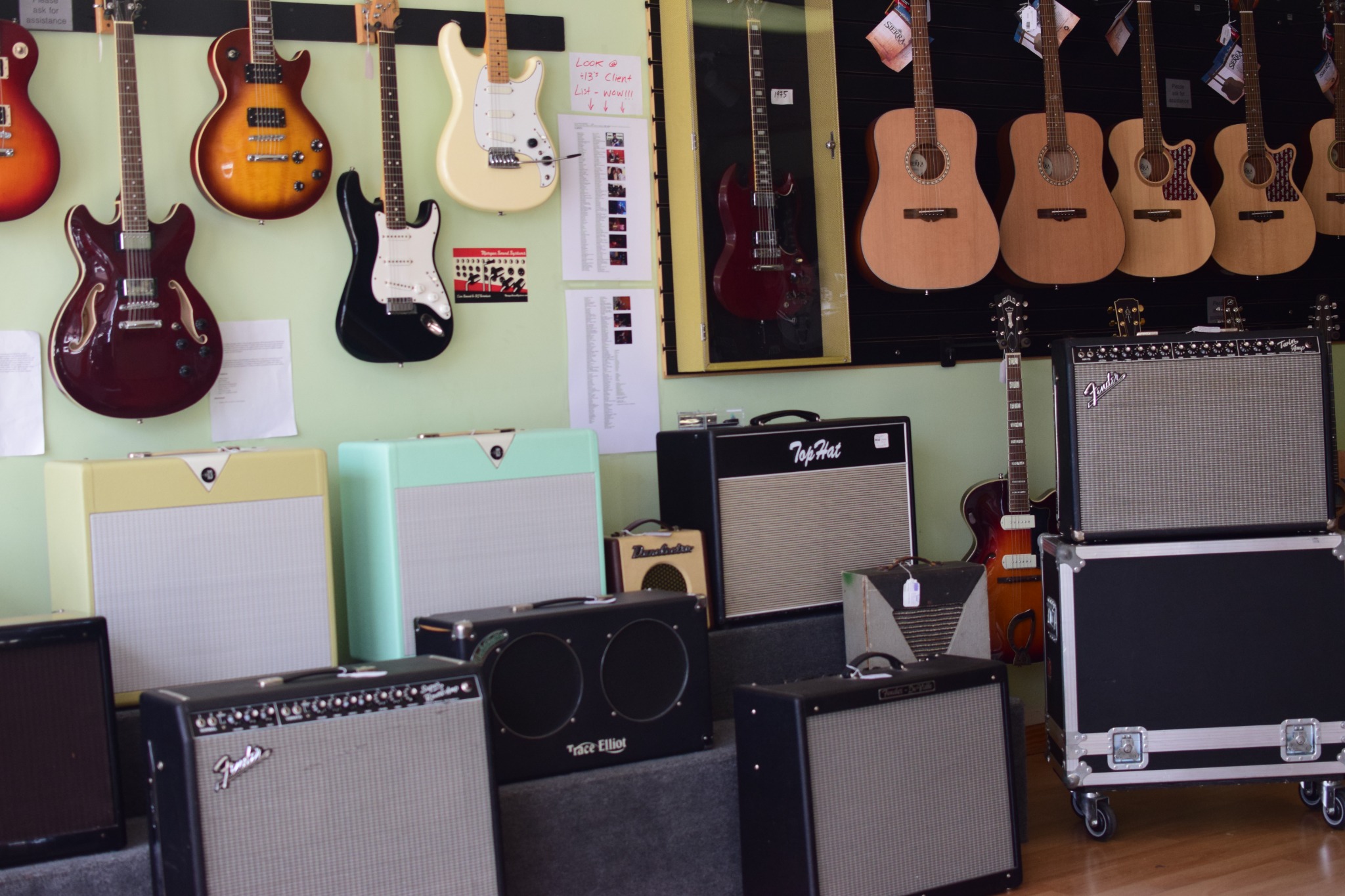 Amplifiers and acoustic guitars in the showroom