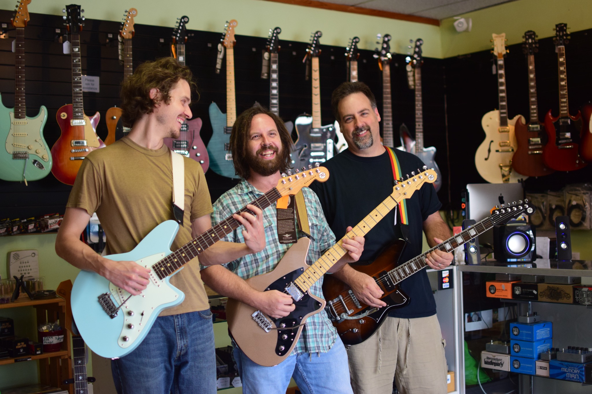 Friends sharing a moment with guitars