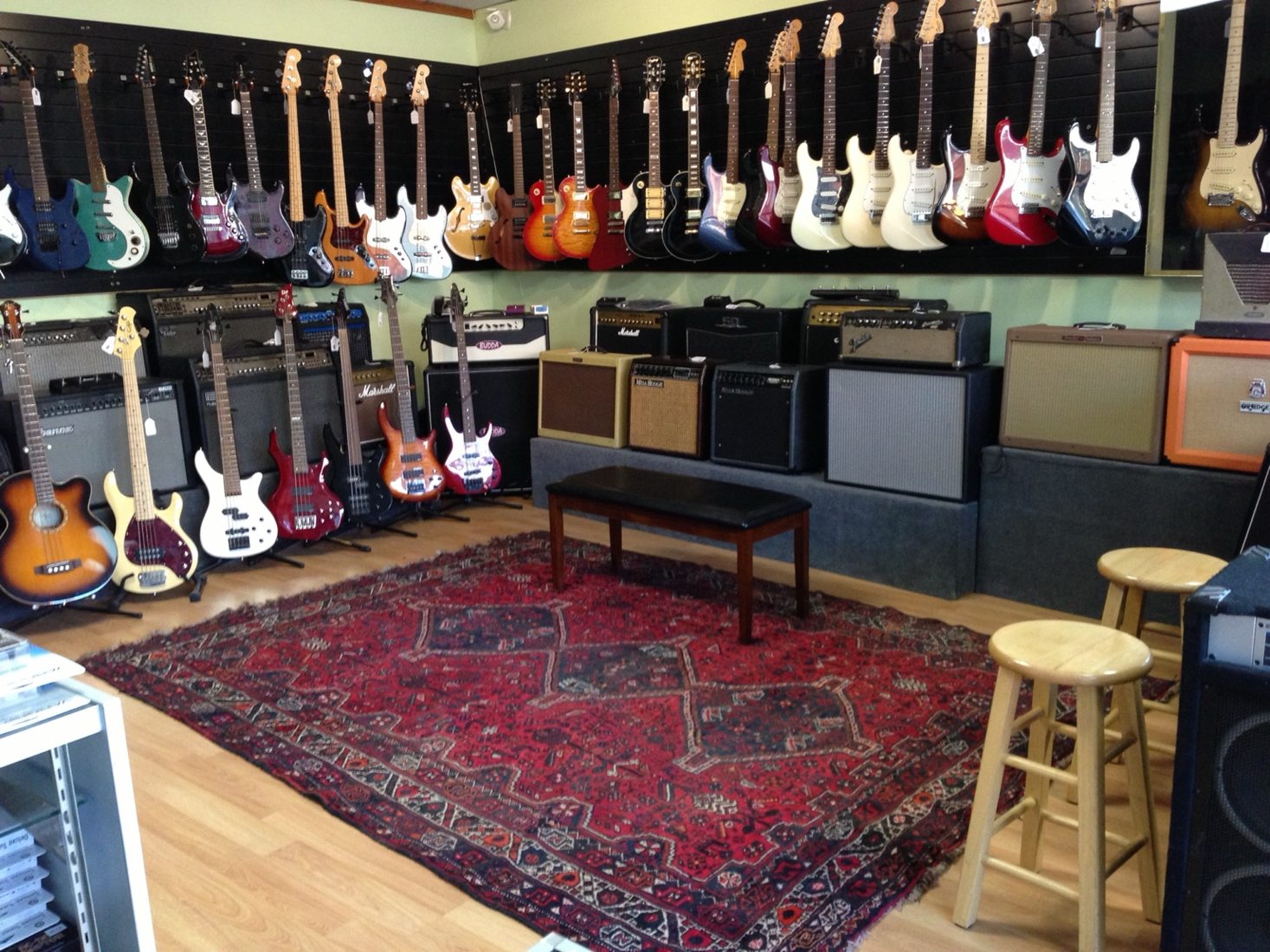 Guitars and amplifiers lining the showroom