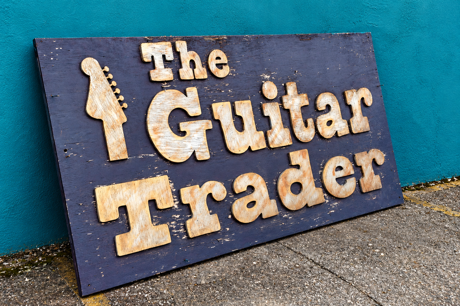 Original wooden The Guitar Trader shop sign